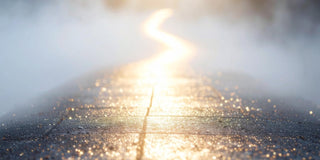 Soft sunlight illuminating a reflective surface, creating a gentle sense of warmth, clarity, and release.