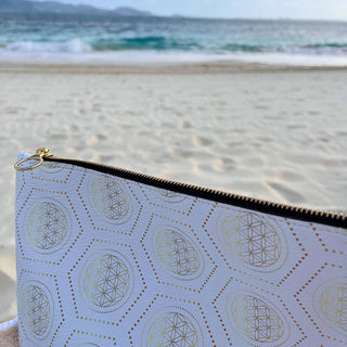 Pouch with geometric pattern on a beach