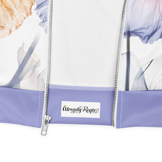 Detail of the Already Regis® Luminous Petals Bomber Jacket showing the floral print and lavender accents