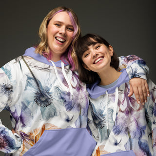 Two women wearing the Already Regis® Luminous Petals Unisex Hoodie