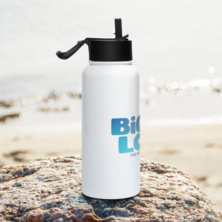 Biggie Love 32 oz stainless steel water bottle by The Happy Channel on a beach rock with ocean background