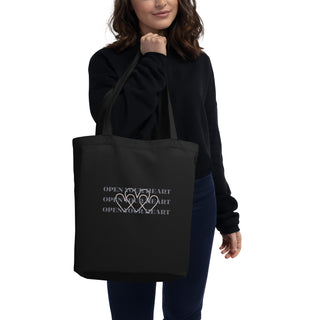 The Happy Channel® Open Your Heart Eco Tote Bag worn by model, front view