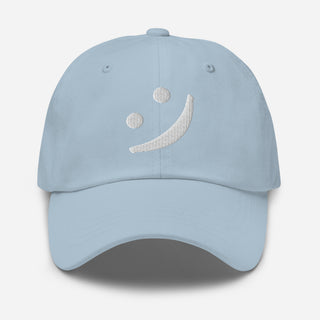 Front view of The Happy Channel® Smile Dad Hat in Sky Blue with white embroidered smile