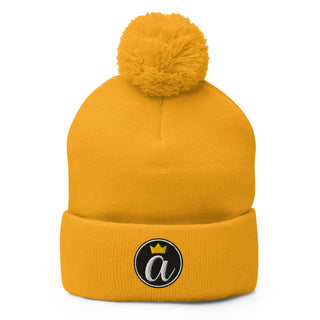 Gold Already Regis® Crowned Pom-Pom Beanie with embroidered crown design