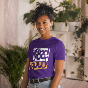 The Happy Channel® #FindYourHappy Unisex T-Shirt in Purple, featuring bold white and orange text design, on female model.